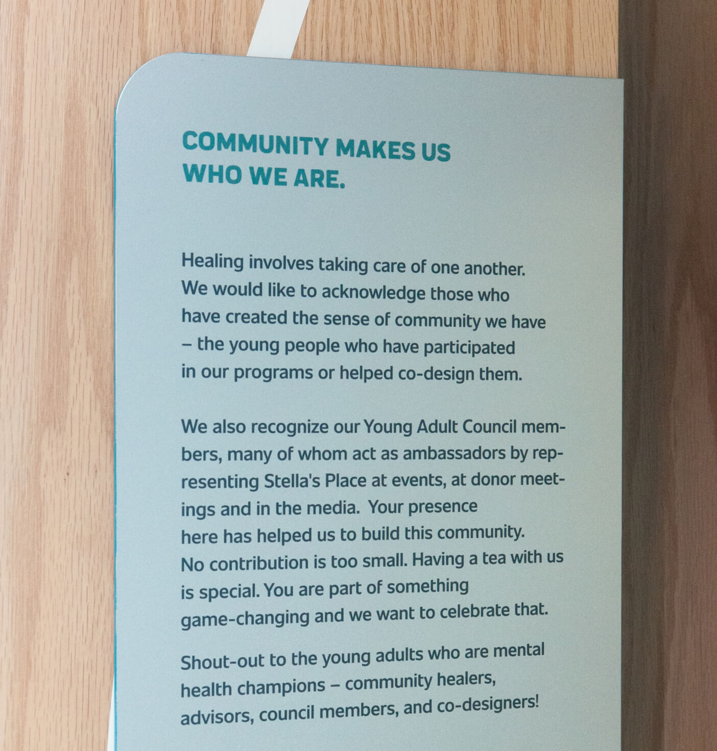 A close-up of a sign describing the community at Stella's Place.