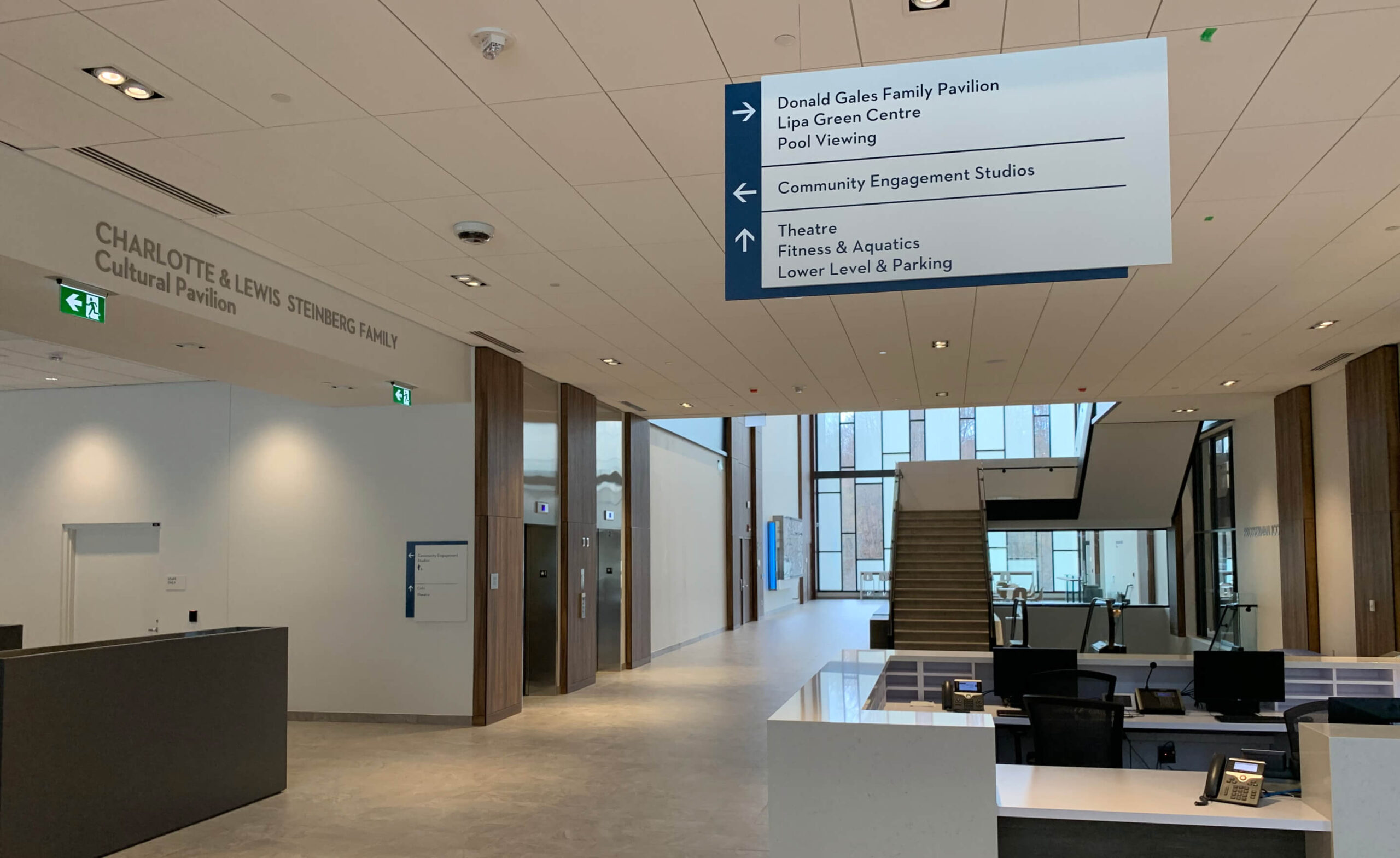Interior of UJA building, with a focus on wayfinding signage.